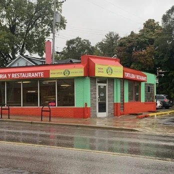 La Guadalupana's red, green and yellow corner storefront on Division Ave S